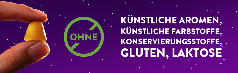 Ein WICK ZzzQuil Gute Nacht Weichgummi mit Mango- und Bananengeschmack wird gezeigt. Der Text daneben sagt: ohne künstliche Aromen, künstliche Farbstoffe, Konservierungsstroffe, Gluten und Laktose